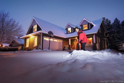 Man shoveling snow off driveway - Model released