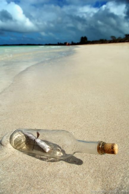 Message in a bottle on beach