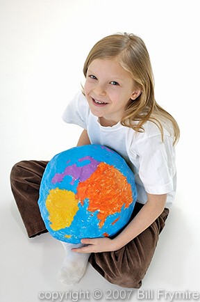 child holding world in lap