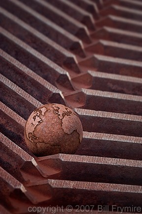 Rusty iron globe on gears