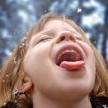 girl catching snowflake
