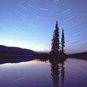 star trails over lake