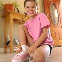 girl tying shoelaces